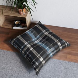 Square tufted floor pillow with dark tartan pattern and light blue streaks