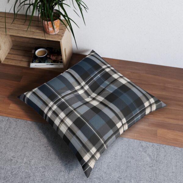 Square tufted floor pillow with charcoal gray and muted blue tartan plaid pattern