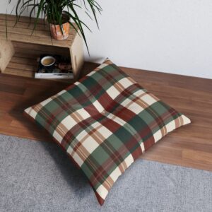 Square tufted floor pillow with green red and brown plaid design