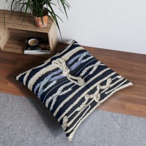 Tufted floor pillow with a striking pattern of rope knots over navy stripes