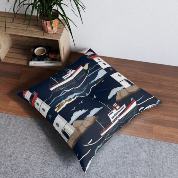 Tufted floor pillow with lighthouses and sailing ships against navy stripes