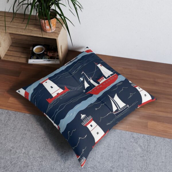 Tufted floor pillow with lighthouse beacons and sailing ships on navy stripes