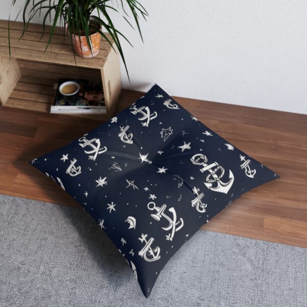 Anchors twinkle against dark blue floor pillow with a night sky effect