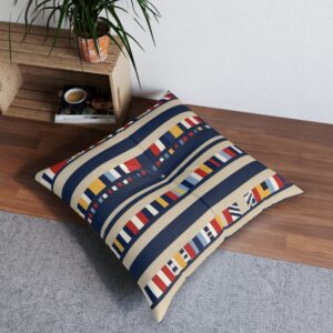 Nautical stripes and signal flags tufted floor pillow on wooden floor