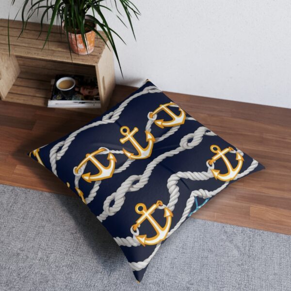 Navy tufted floor pillow with golden anchors and classic ropes