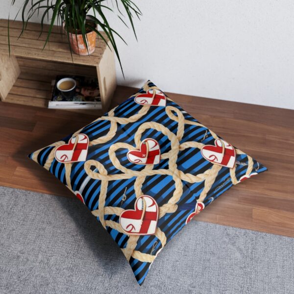 Nautical love tufted floor pillow with a series of rope and anchor design