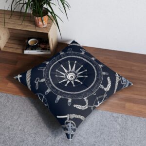 Navy blue tufted floor pillow with ship's helm and wrapped ropes design