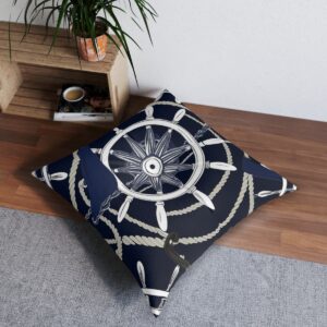 Navy tufted floor pillow with intricate ship's wheel and rope design