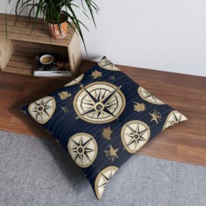 Golden compass design tufted floor pillow on classic navy background