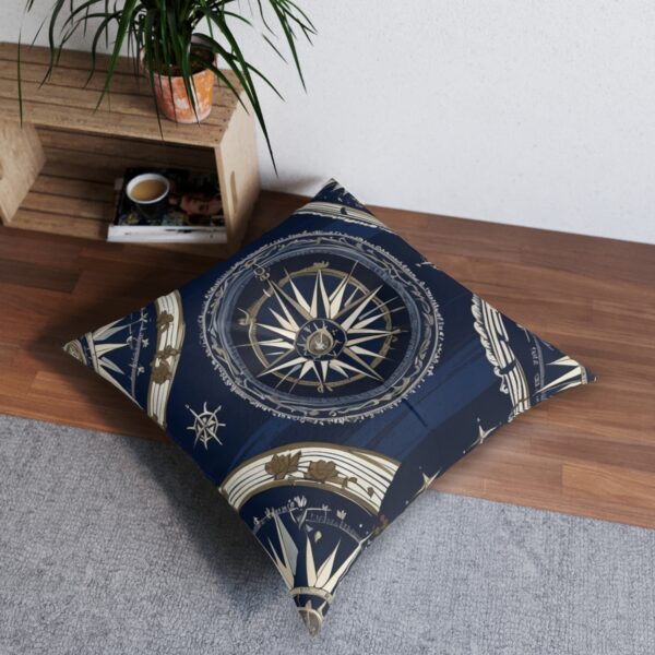 Vintage navigational-themed floor pillow with compass and sextants on navy-striped backdrop