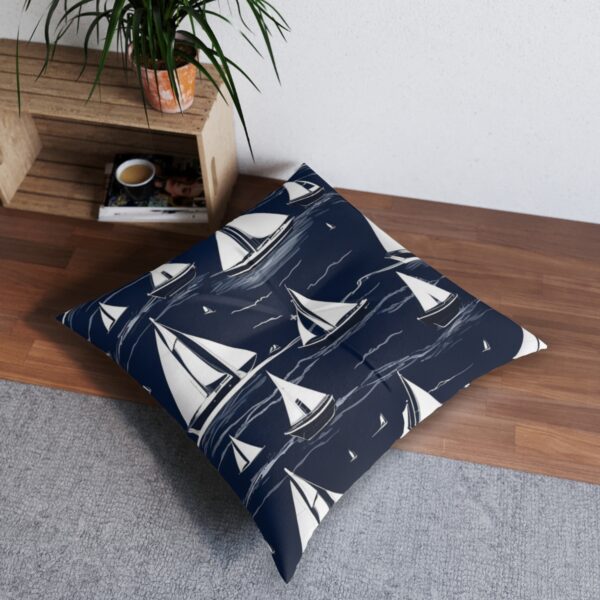 White sailboat silhouettes on navy tufted floor pillow