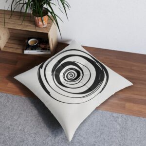 Cushion cover with bold black spiral on crisp white background embodying minimalist design