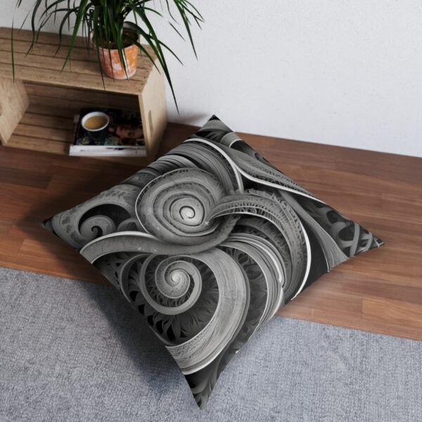 Cushion cover with intricate interwoven spirals in monochrome drawing eye to endless depth