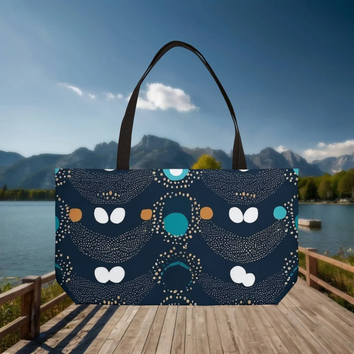 Flat view of a navy blue weekender tote bag with abstract polka dot design in teal, gold, and white