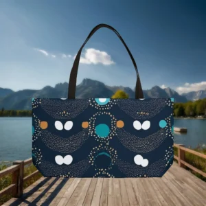 Flat view of a navy blue weekender tote bag with abstract polka dot design in teal, gold, and white