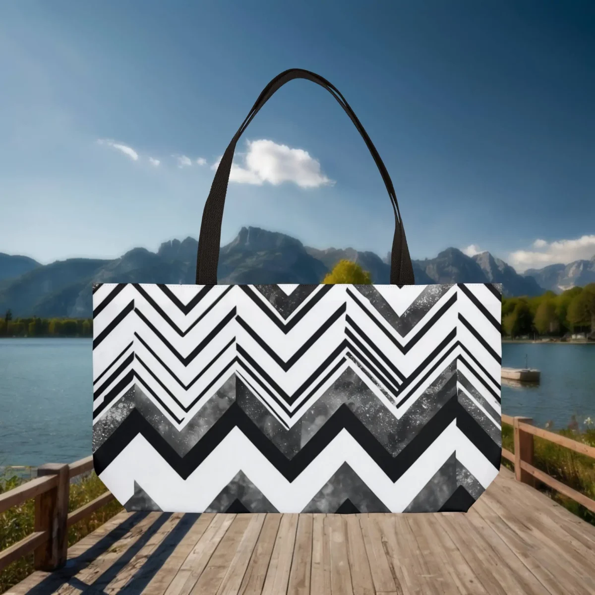 Weekender tote bag with black and white chevron stripe pattern, displayed flat