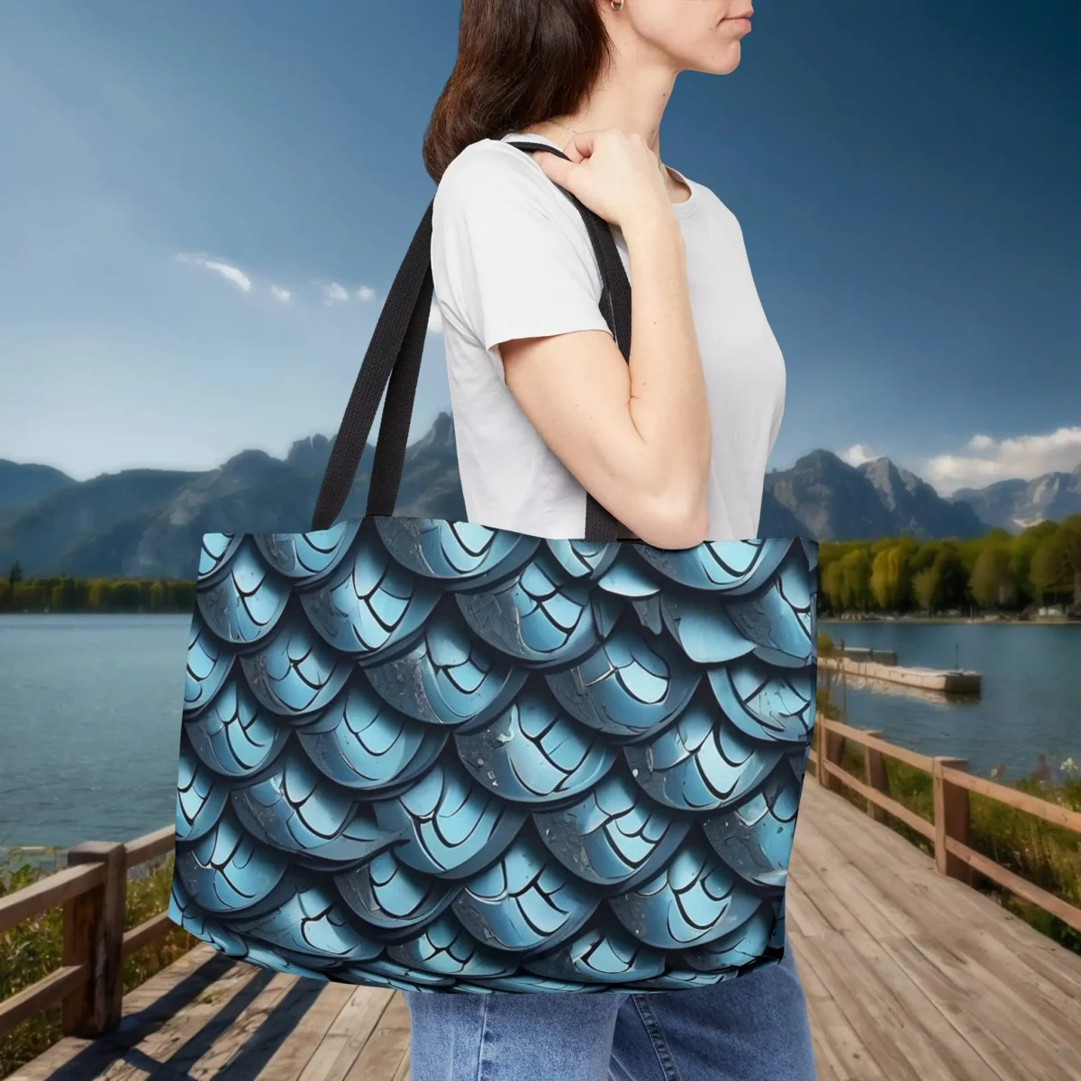 Woman carrying a blue weekender tote bag with fish scale print