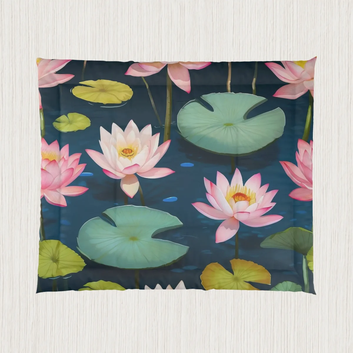 Flat view of a comforter with blooming pink water lilies and floating lily pads on a calm pond