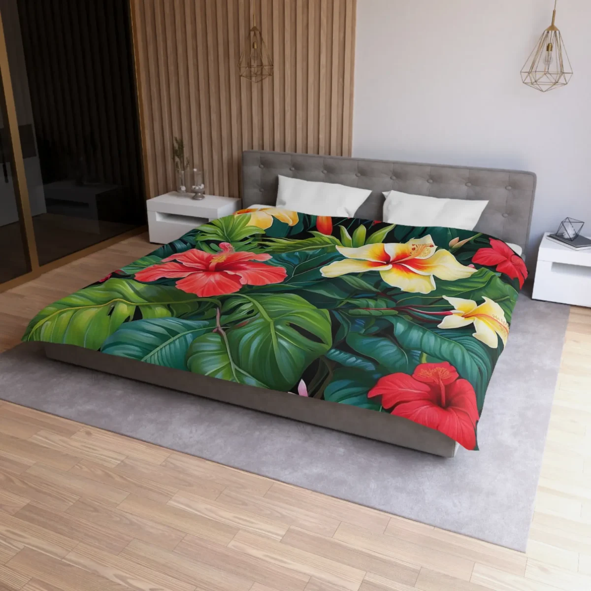 Microfiber duvet cover with bold red and yellow hibiscus flowers and lush tropical leaves on a bed