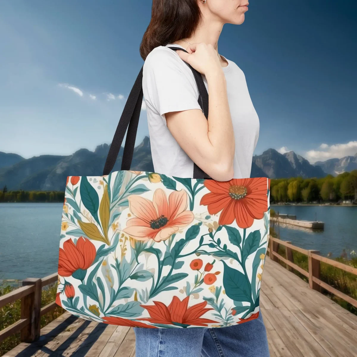 Woman carrying a weekender tote bag with bright floral bloom pattern