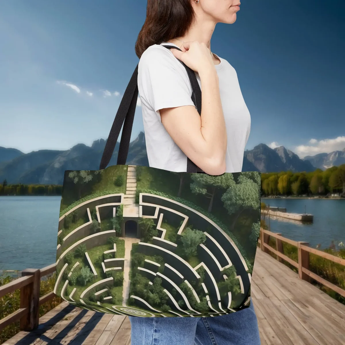 Woman carrying a weekender tote bag with Greek labyrinth pattern in green tones