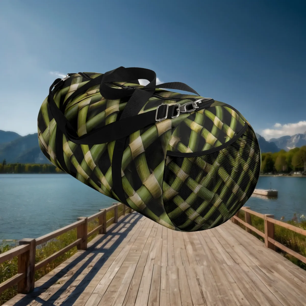 Side view of large duffel bag with green woven bamboo design and black mesh pocket.