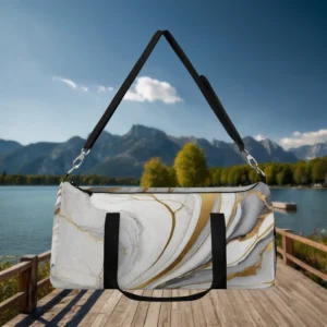 Front view of large duffel bag with white marble pattern and golden veins, suspended by a black strap.