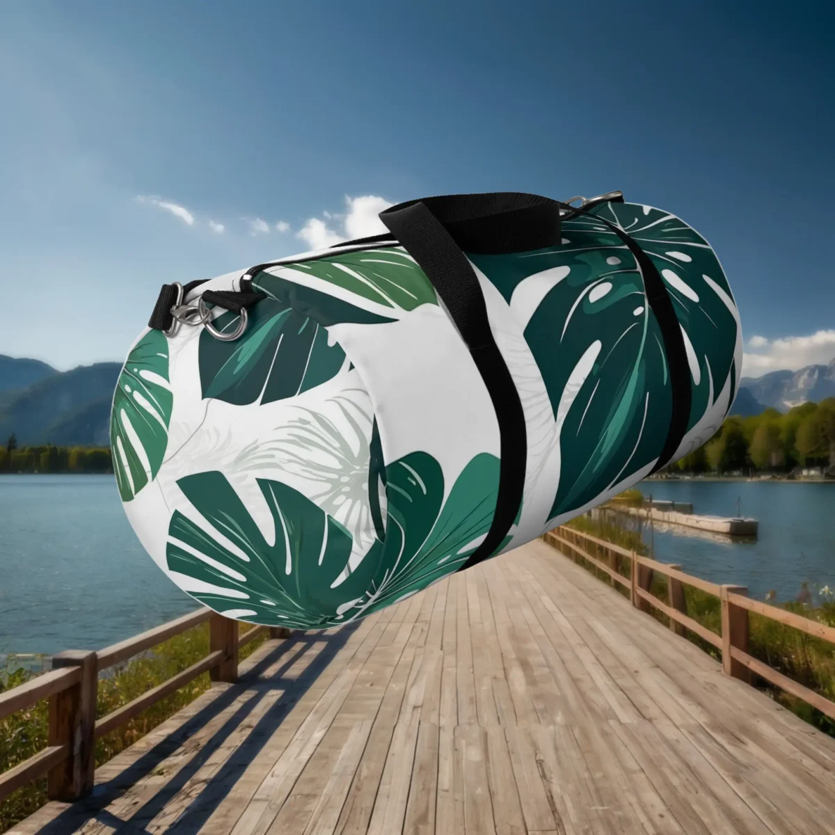 Large duffel bag with green monstera leaves and white base, floating over wooden dock.