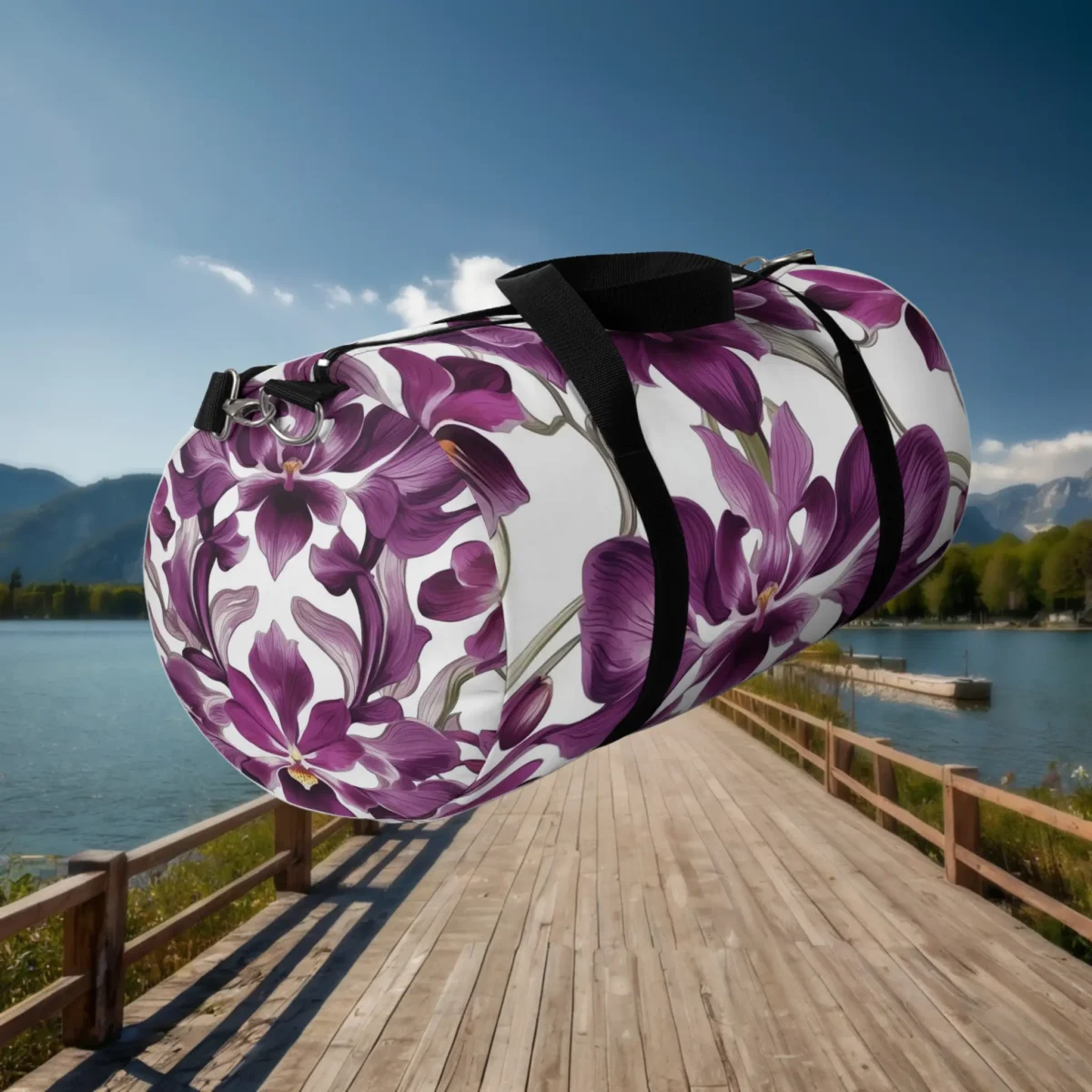 Floating angled view of large orchid flower duffel bag with white base and purple florals.