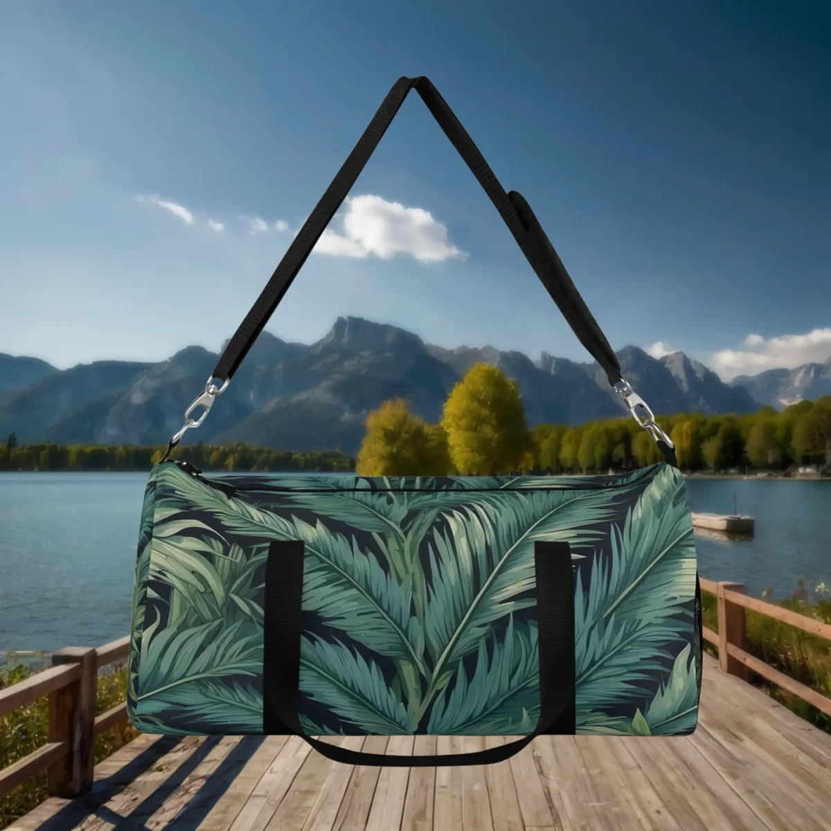Front view of a large duffel bag featuring overlapping palm fronds in green on dark background.