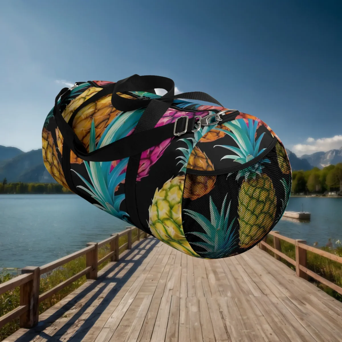 Side view of large duffel bag with pineapple pattern and mesh pocket detail.