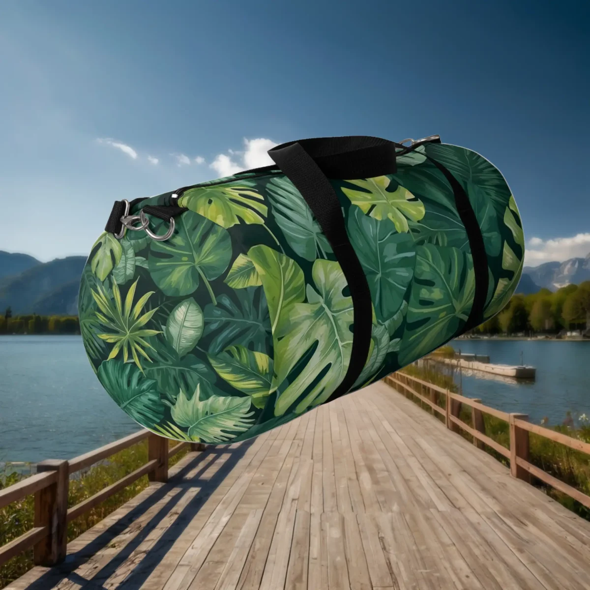Angled view of large duffel bag with overlapping tropical leaves in various green shades.