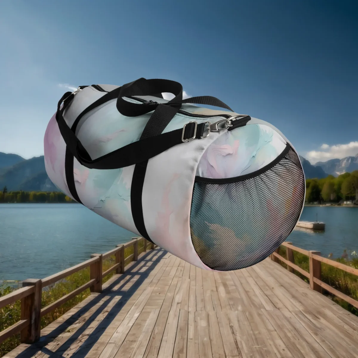 Side view of large pastel watercolor duffel bag with black mesh pocket and straps floating over a dock.