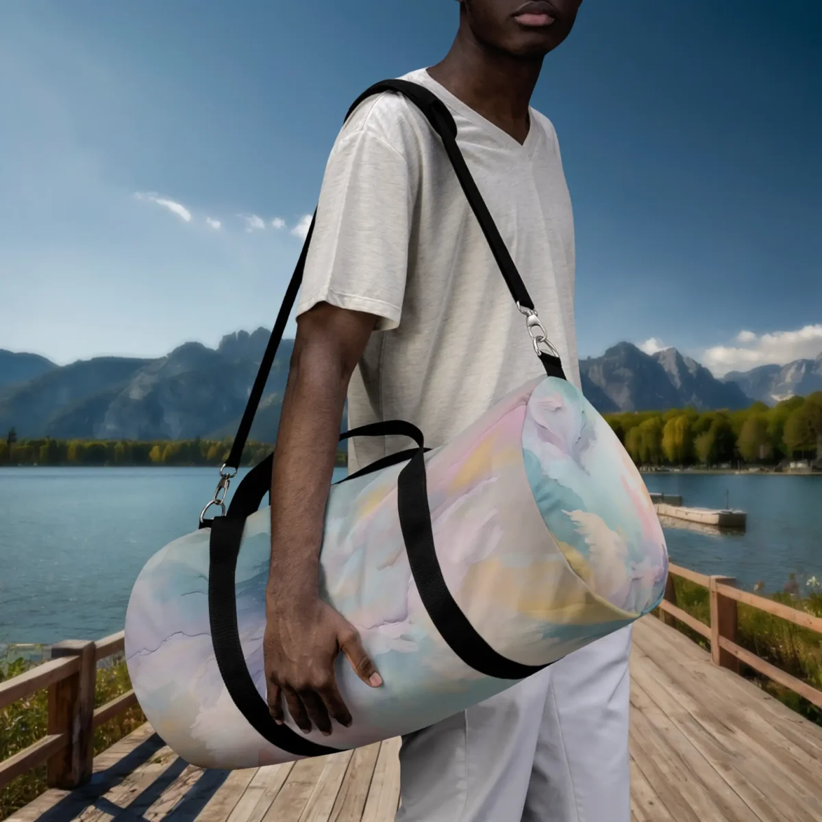 Man carrying a large pastel watercolor duffel bag by hand with shoulder strap near a lakeside dock.
