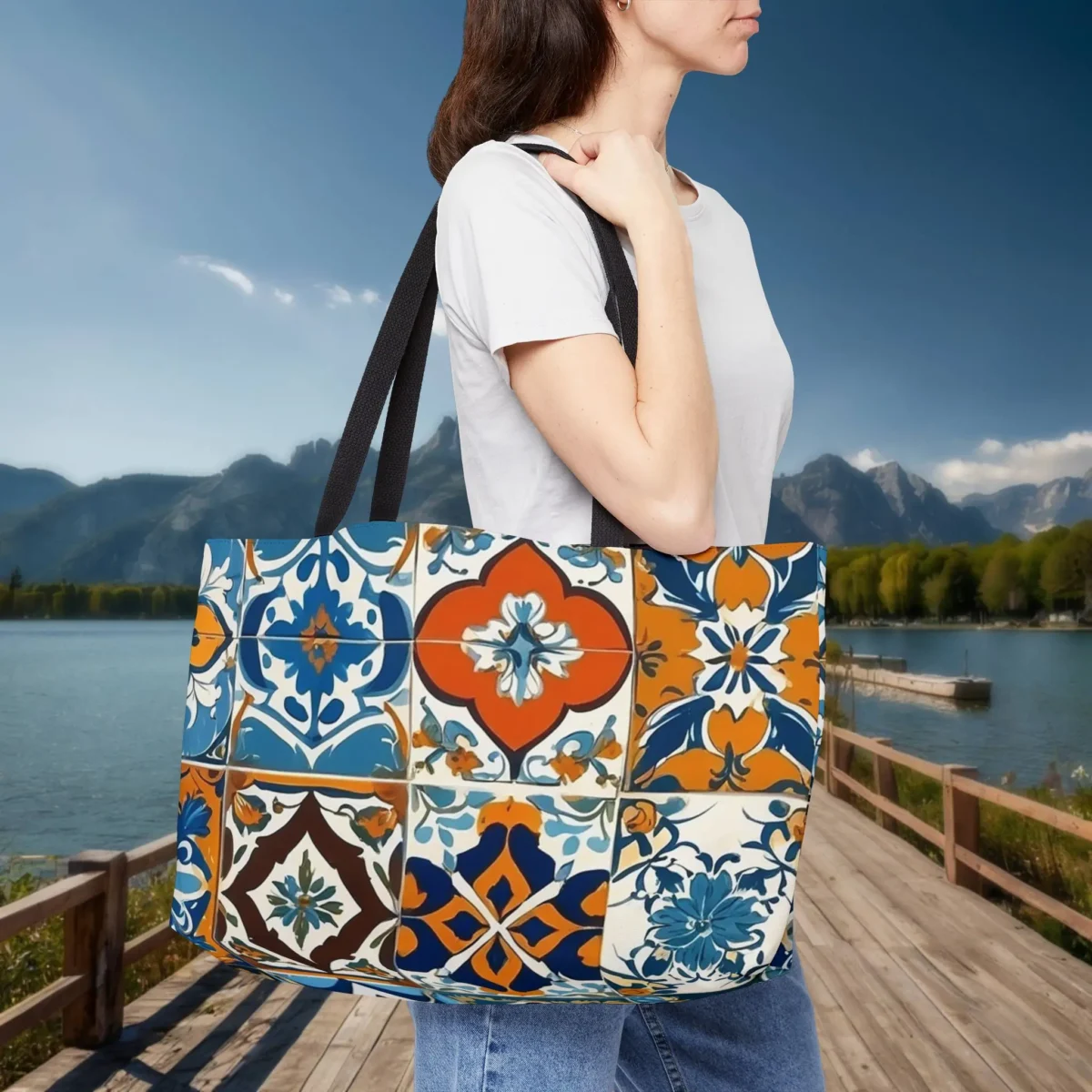 Woman carrying a weekender tote bag with Moroccan tile pattern in rich colors
