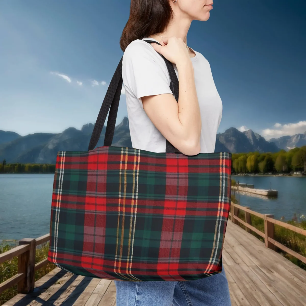 Woman carrying a red tartan plaid weekender tote bag