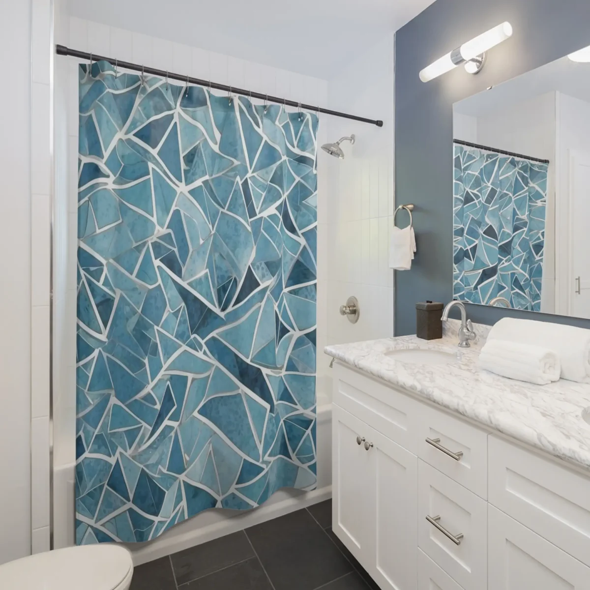 Modern blue shower curtain with angular geometric pattern in bathroom setting