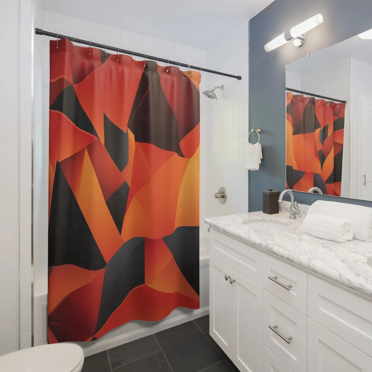 Shower curtain with abstract red and orange polygon design in a modern bathroom