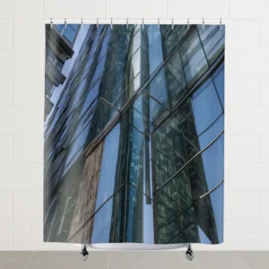 Flat view of a shower curtain featuring a reflective glass skyscraper façade with modern angles