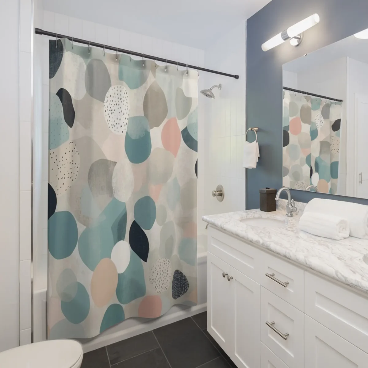 Shower curtain with abstract soft-colored circular shapes in a minimalist bathroom setting