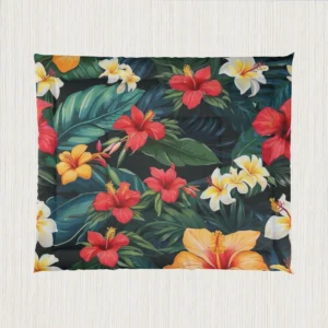 Flat view of comforter showcasing a dense tropical pattern of hibiscus flowers and green foliage