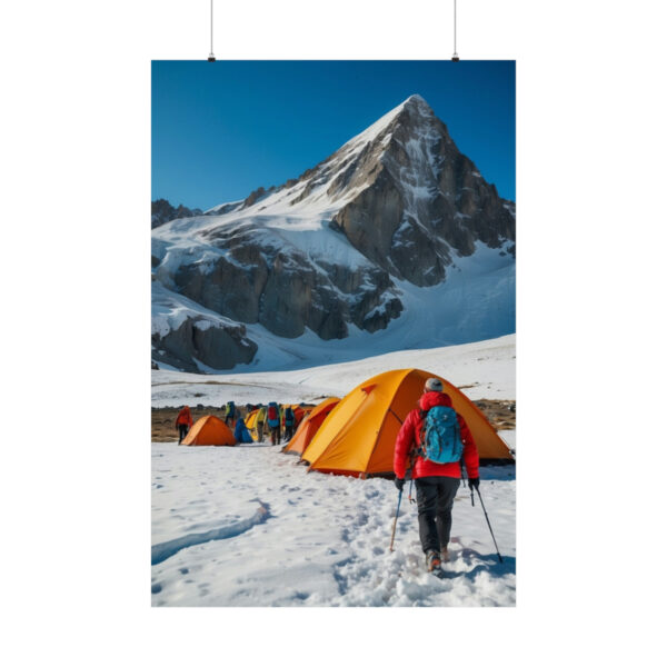 Hiker approaching a campsite with orange tents in a snowy mountain landscape