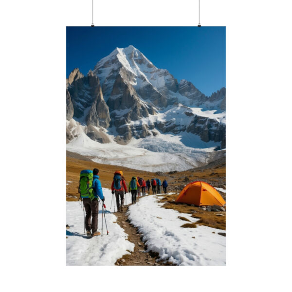 Group of hikers walking toward a snowy mountain with a campsite in view