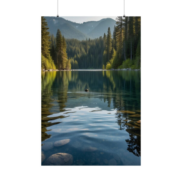 Calm lake reflecting trees and mountains in a serene forest setting