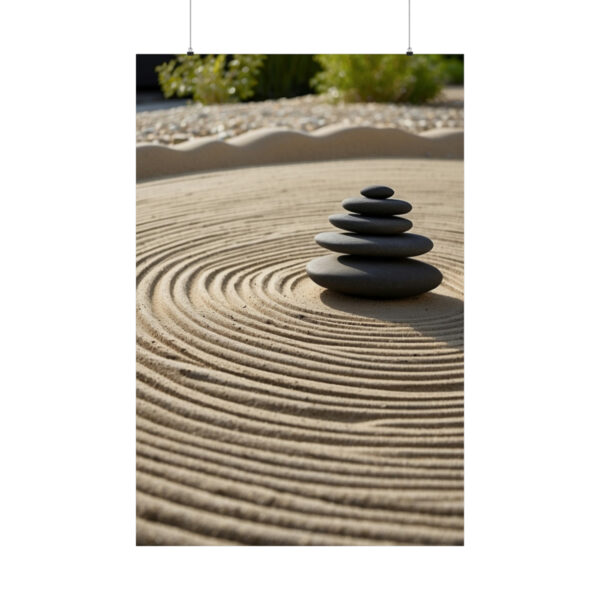 stack of balanced stones on raked sand in a zen garden