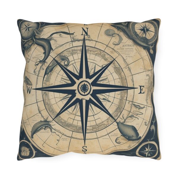 outdoor pillow with a vintage nautical compass design featuring whales and sea creatures on a beige background