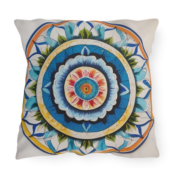 Blue and white mandala design outdoor pillow with intricate floral patterns