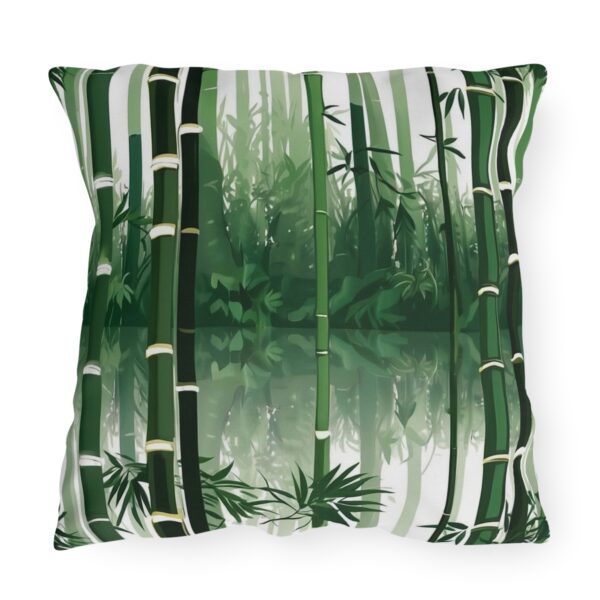 outdoor pillow featuring tall green bamboo stalks with lush foliage and a misty background