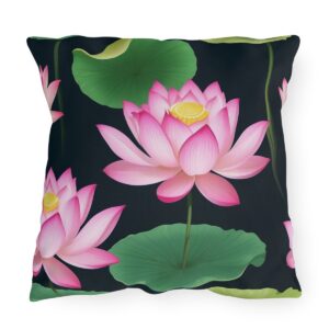 outdoor pillow featuring pink lotus flowers with green leaves on a black background