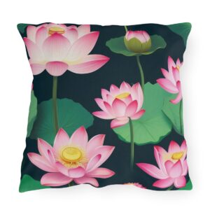 outdoor pillow featuring pink lotus flowers with green leaves on a black background